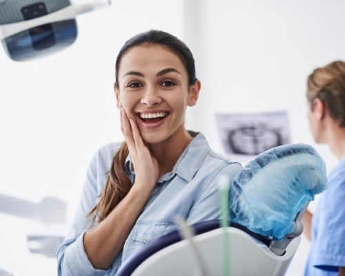 Woman smiling while visiting the top rated dentist in New City