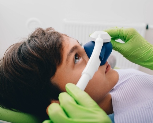Young patient receiving nitrous oxide sedation dentistry