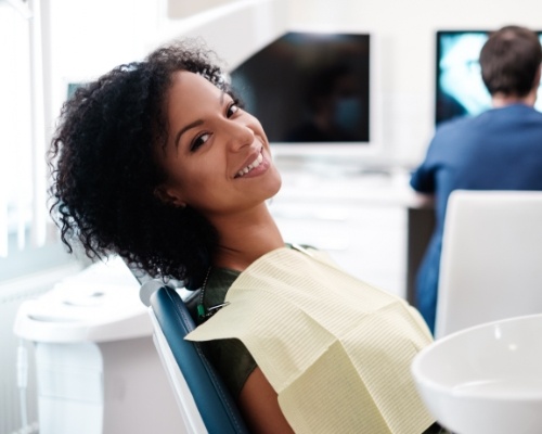 Woman smiling during emergency dentistry visit