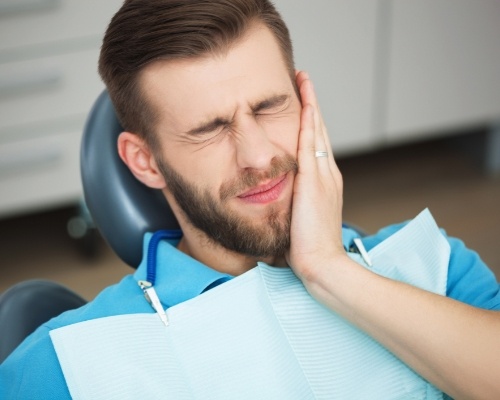 Man in pain before emergency dentistry