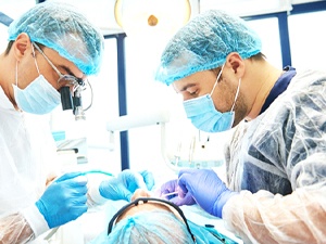 Dental surgeons placing dental implants in New City, NY