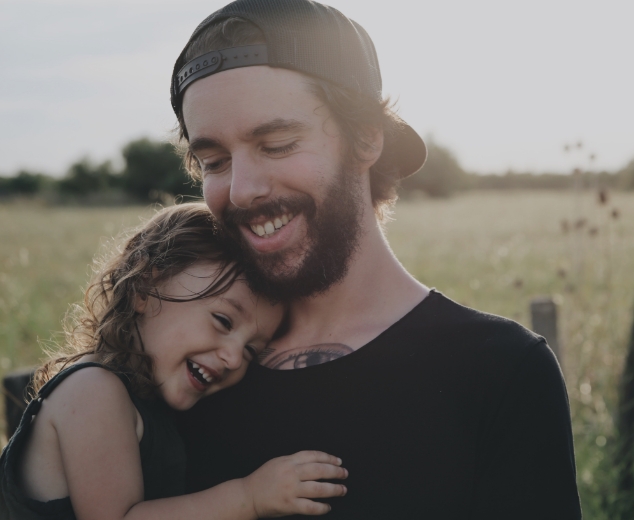 Father and child smiling after children's dentistry visit