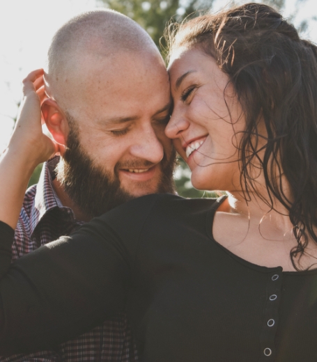 Man and woman with flawless smiles after cosmetic dentistry