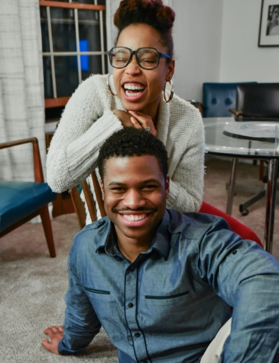 Man and woman with straight smile after Invisalign treatment