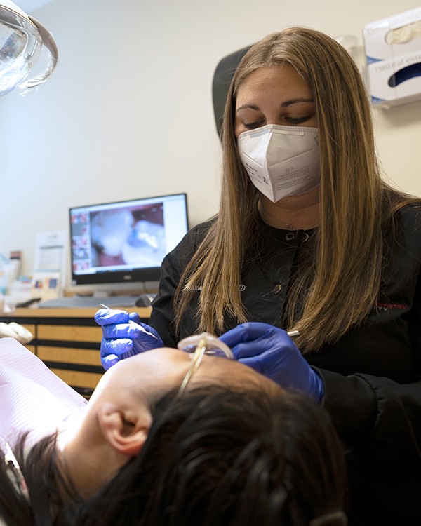 Dentist treating dental patient