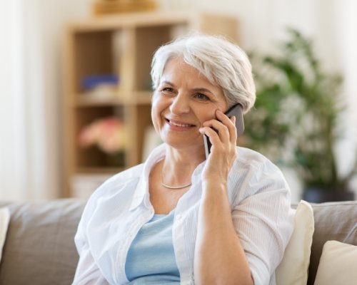 Woman discussing dental insurance coverage with dentist