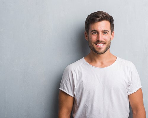 man smiling after Invisalign in New City