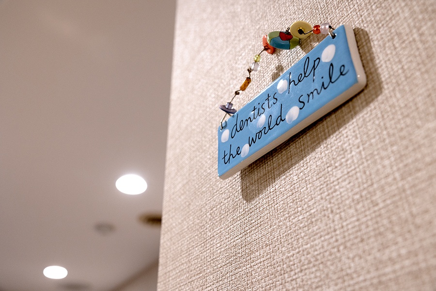 Dentists help the world smile sign