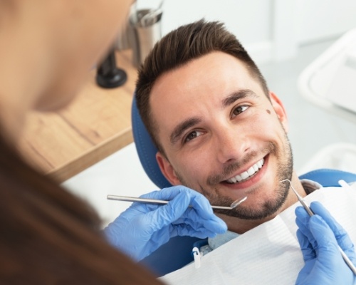 Man smiling during preventive dentistry checkup and teeth cleaning