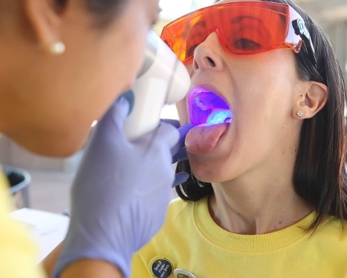 Patient receiving oral cancer screening