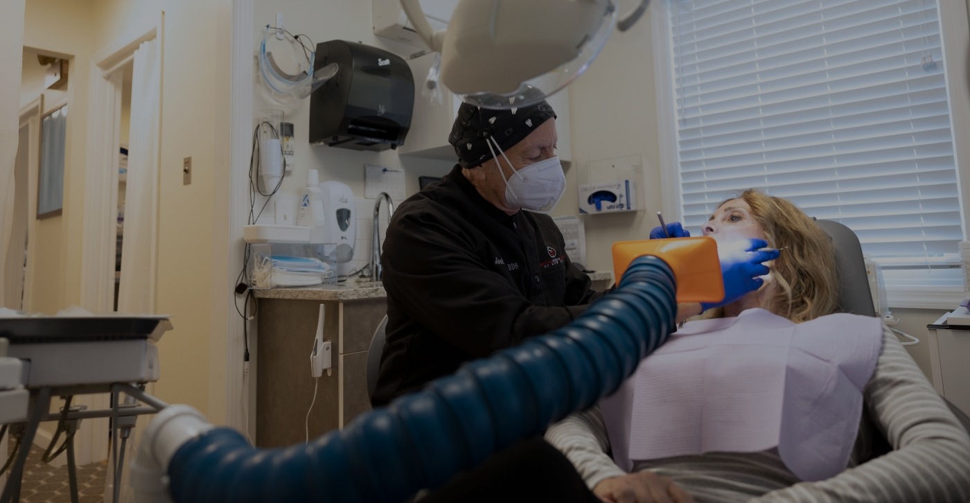 Dentist safely treating dental patient