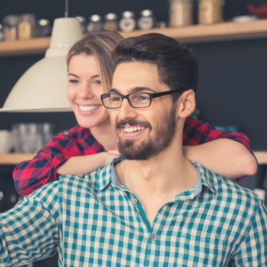 Man and woman with healthy smiles thanks to preventive dentistry