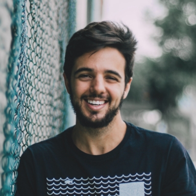 Man with perfectly aligned smile after Invisalign treatment