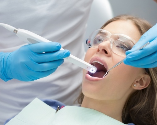 Dentist capturing images with intraoral camera