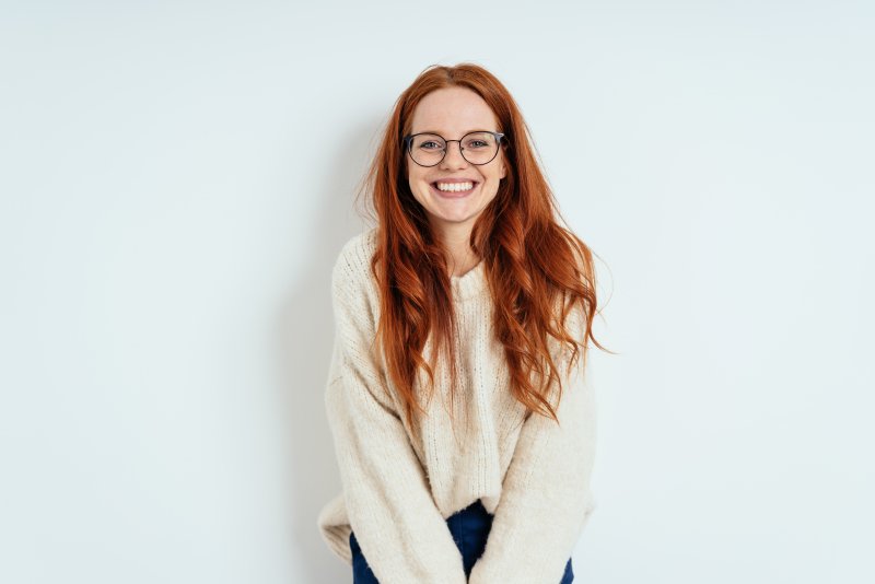 woman smiling with dental implants in New City